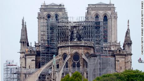 PARIS, FRANCE - APRIL 16: The cathedral of Notre-Dame de paris is seen the day after the massive fire that ravaged its roof on April 16, 2019 in Paris, France. A fire broke out on Monday afternoon and quickly spread across the building, collapsing the spire. The cause is unknown but officials said it was possibly linked to ongoing renovation work.  (Photo by Chesnot/Getty Images)