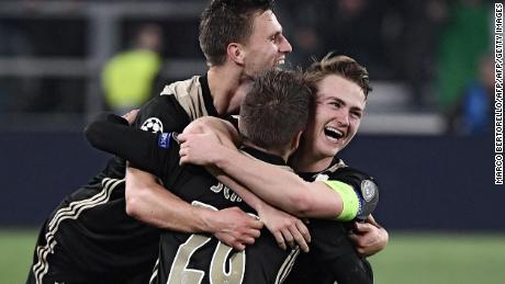 Ajax&#39;s Dutch defender Joel Veltman, Ajax&#39;s Danish midfielder Lasse Schone and Ajax&#39;s Dutch defender Matthijs de Ligt celebrate their team&#39;s win over Juventus.