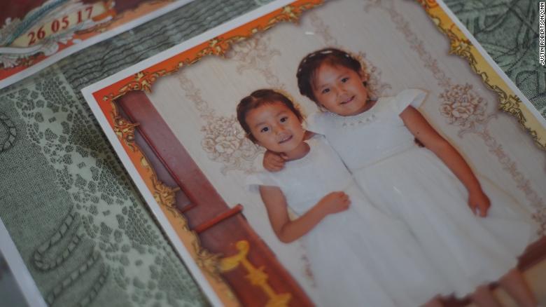 Adbia Hayrat&#39;s two daughters, Ansila Esten and Nursila Esten, in a family photo kept by their father.