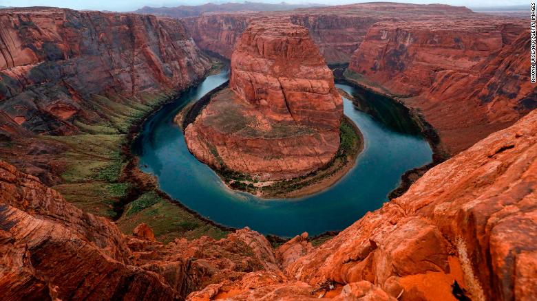 The Colorado River wraps around Horseshoe Bend near Page, Arizona. A study last year found that the river&#39;s flows have decreased by about 20% over the last century, due in large part to climate change.