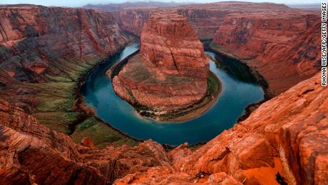 The Colorado River wraps around Horseshoe Bend in the in Glen Canyon National Recreation Area in Page, Arizona, on February 11, 2017. / AFP PHOTO / RHONA WISE        (Photo credit should read RHONA WISE/AFP/Getty Images)