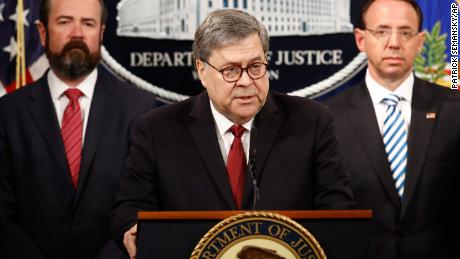 Attorney General William Barr speaks alongside Deputy Attorney General Rod Rosenstein, right and Deputy Attorney General Ed O'Callaghan, left, about the release of a redacted version of special counsel Robert Mueller's report during a news conference, Thursday, April 18, 2019, at the Department of Justice in Washington. (AP Photo/Patrick Semansky)