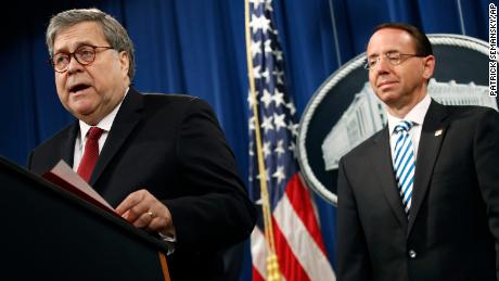 Attorney General William Barr speaks alongside Deputy Attorney General Rod Rosenstein, right, Thursday, April 18, 2019, at the Department of Justice in Washington. (AP Photo/Patrick Semansky)