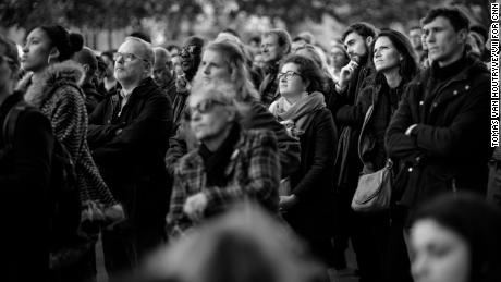 An overflow crowd celebrates Mass in the public square in front of the Church of Saint-Sulpice during Holy Week in Paris. The Mass was originally scheduled to be held in the Cathedral of Notre Dame.