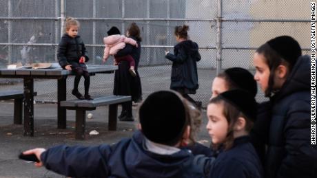 Children at a playground in Williamsburg, which has seen 294 confirmed cases of measles.