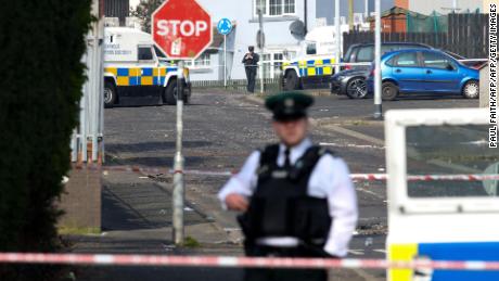 Police secure the area where a journalist was fatally shot amid rioting overnight in the Creggan area of Derry in Northern Ireland on April 19, 2019.