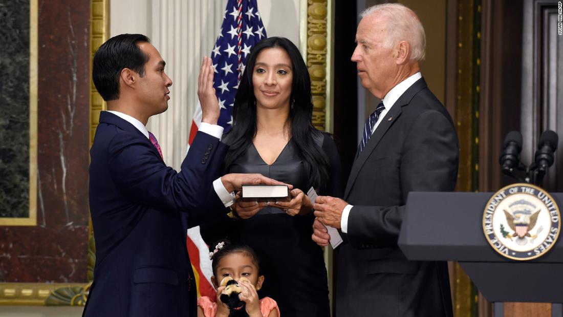 Castro is joined by his wife as he is ceremonially sworn in by Biden in August 2014.