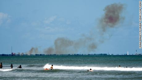 Orange smoke is seen rising above SpaceX&#39;s facilities at Cape Canaveral Air Force Station on Saturday, April 20, 2019. The Air Force confirmed an anomaly occurred with the company&#39;s Crew Dragon capsule. Space X