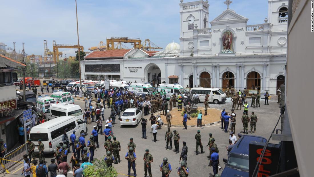 Sri Lankan military members stand guard outside St. Anthony&#39;s Church following an explosion. 