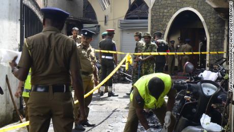 Sri Lankan security personnel and investigators look through debris outside Zion Church following an explosion in Batticaloa in eastern Sri Lanka on April 21, 2019. - A series of eight devastating bomb blasts ripped through high-end hotels and churches holding Easter services in Sri Lanka on April 21, killing nearly 160 people, including dozens of foreigners. (Photo by LAKRUWAN WANNIARACHCHI / AFP)LAKRUWAN WANNIARACHCHI/AFP/Getty Images