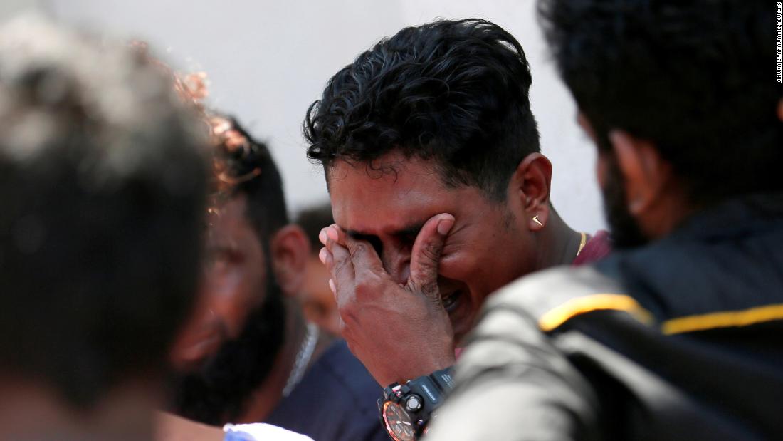 A relative of a victim of an explosion at St. Anthony&#39;s Shrine reacts outside the police mortuary in Colombo.  