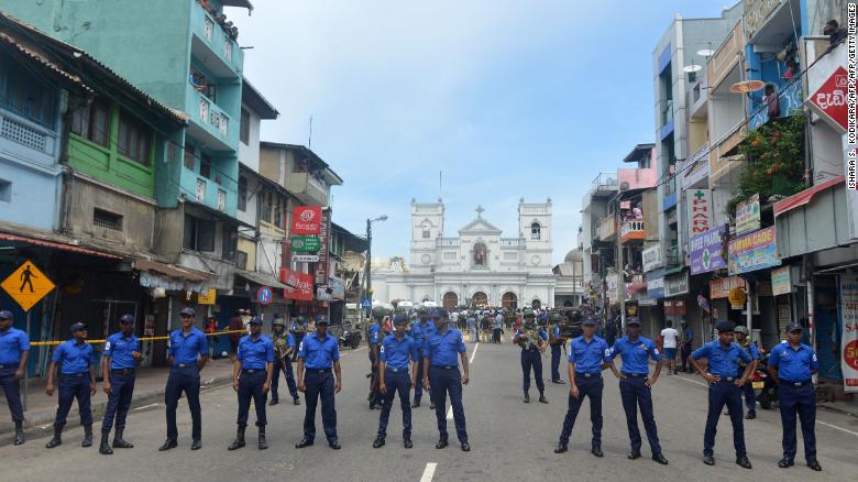 Sri Lankan security personnel keep watch outside a church in Colombo after a blast Sunday. 