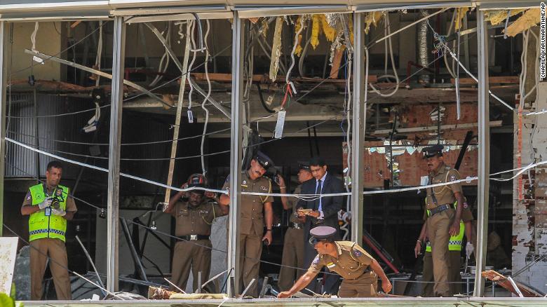 A Sri Lankan officer inspects a blast site at the Shangri-La hotel in Colombo.