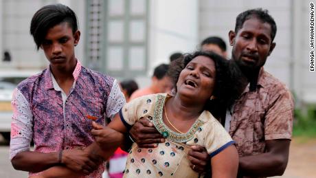 Relatives of a blast victim grieve outside a morgue in Colombo, Sri Lanka, Sunday, April 21, 2019.  More than hundred were killed and hundreds more hospitalized with injuries from eight blasts that rocked churches and hotels in and just outside of Sri Lanka's capital on Easter Sunday, officials said, the worst violence to hit the South Asian country since its civil war ended a decade ago. (Eranga Jayawardena/AP)