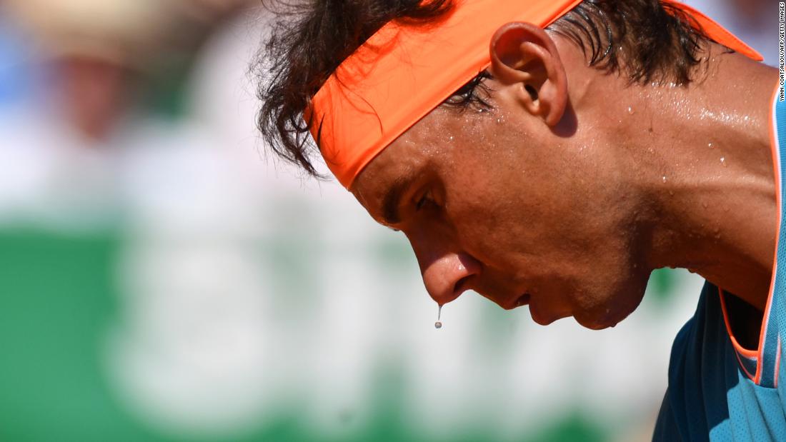 Sweat drips from the nose of Spain&#39;s Rafael Nadal during his tennis match against fellow Spaniard Roberto Bautista Agut on Wednesday, April 17, in Monaco.