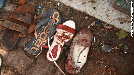 TOPSHOT - Shoes and belongings of victims are collected as evidence at St Sebastian&#39;s Church in Negombo on April 22, 2019, a day after the church was hit in series of bomb blasts targeting churches and luxury hotels in Sri Lanka. - At least 290 are now known to have died in a series of bomb blasts that tore through churches and luxury hotels in Sri Lanka, in the worst violence to hit the island since its devastating civil war ended a decade ago. (Photo by Jewel SAMAD / AFP)        (Photo credit should read JEWEL SAMAD/AFP/Getty Images)