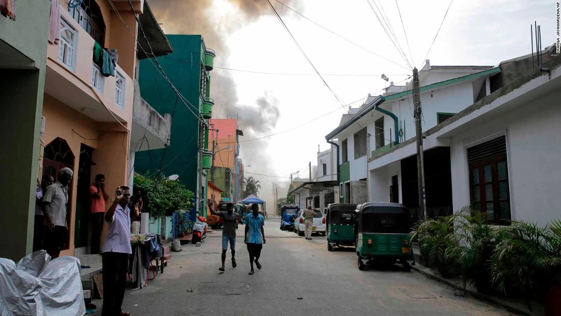 Smoke rises from the area where a van exploded on Monday near St. Anthony&#39;s shrine in Colombo.