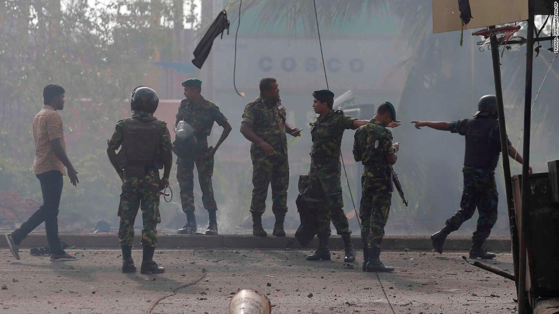 Sri Lankan security forces stand at the site near St. Anthony&#39;s shrine in Colombo after they performed a controlled detonation of a suspicious van on Monday.