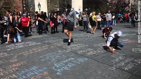 People gathered in NYC&#39;s Washington Square Park last month to &#39;chalk back&#39; against street harassment. 