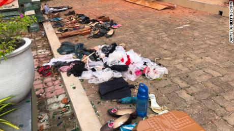 Shoes and clothes removed from St. Sebastian&#39;s Church lie on the ground.