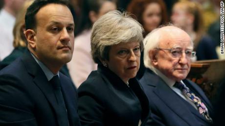 From left, Ireland&#39;s Prime Minister Leo Varadkar, Britain&#39;s Prime Minister Theresa May and Irish President Michael D Higgins attend the funeral of journalist Lyra McKee.