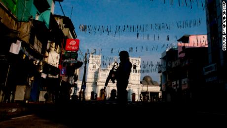 A security officer stands guard outside St. Anthony&#39;s Shrine where bombing was carried out on Easter Sunday, in Colombo.