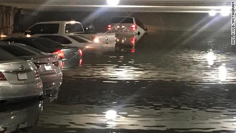 Dozens of cars submerged in Dallas airport parking garage