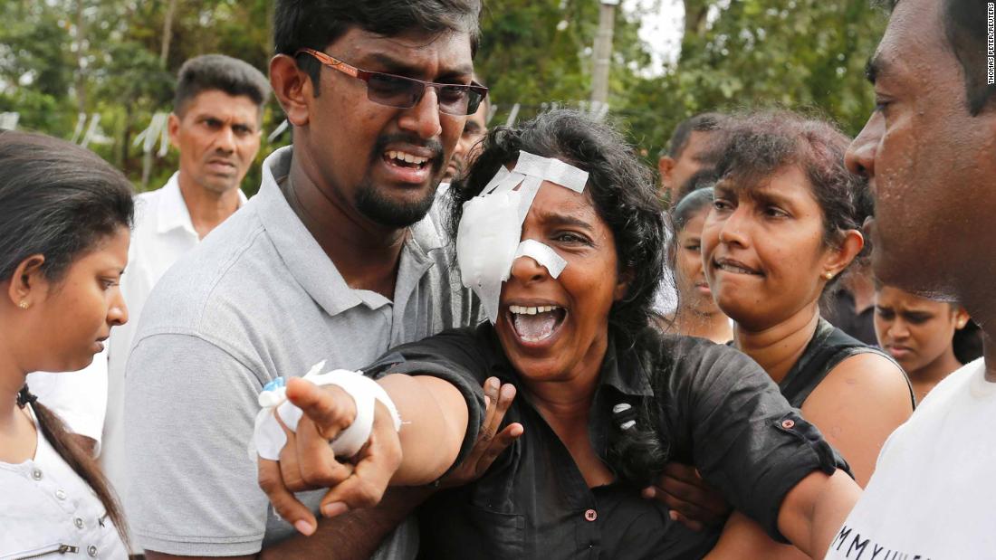 In pictures: Sri Lanka on alert as mourners bury blast victims