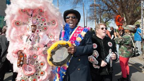 Quint Davis, Jazz Fest&#39;s executive producer, participates in a second-line parade in 2015.