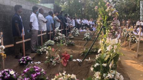 Mourners pay their respects to victims from the St Sebastian&#39;s Church attack.