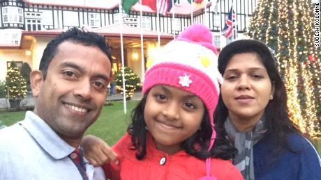 Sudesh Kolonne, Alexendria Kolonne and Manik Suriyaaratchi pose for a family picture.