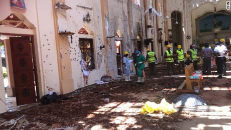 In the days after the bombing, forensic experts sift through the aftermath at St Sebastian&#39;s Church.