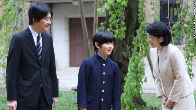 Japan&#39;s Prince Hisahito with his parents, Prince Akishino and Princess Kiko, before attending the entrance ceremony at Ochanomizu University junior high school in Tokyo on April 8, 2019. 