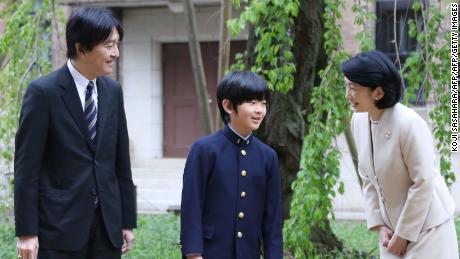 Japan&#39;s Prince Hisahito with his parents, Prince Akishino and Princess Kiko, before attending the entrance ceremony at Ochanomizu University junior high school in Tokyo on April 8, 2019. 