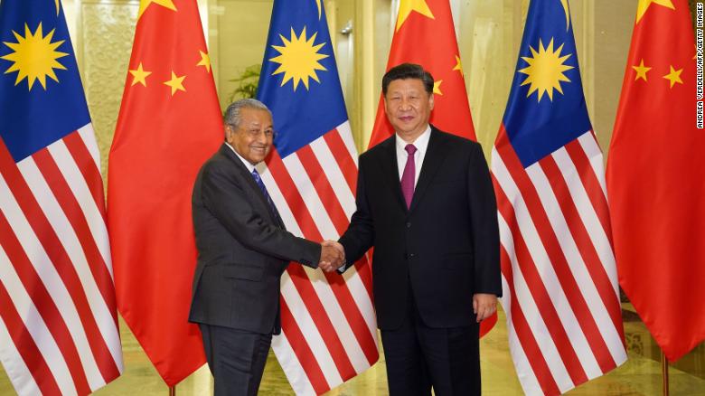 Malaysia Prime Minister Mahathir Mohamad shakes hands with President of the People&#39;s Republic of China Xi Jinping at the Diaoyutai State Guesthouse in Beijing on April 25.