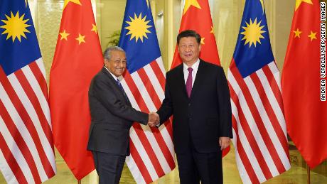 Malaysia Prime Minister Mahathir Mohamad shakes hands with President of the People&#39;s Republic of China Xi Jinping at the Diaoyutai State Guesthouse in Beijing on April 25.