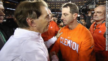 Swinney, right, celebrates winning Clemson&#39;s second national championship in three years. 