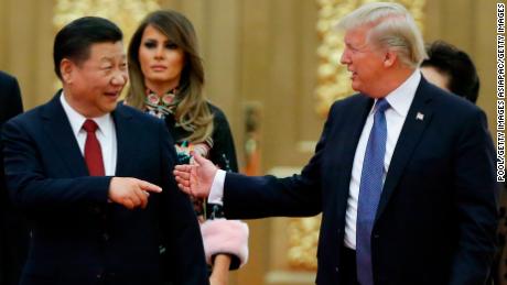 BEIJING, CHINA - NOVEMBER 9: U.S. President Donald Trump and China&#39;s President Xi Jinping arrive at a state dinner at the Great Hall of the People on November 9, 2017 in Beijing, China. Trump is on a 10-day trip to Asia.  (Photo by Thomas Peter - Pool/Getty Images)