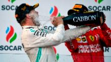 Winner Mercedes&#39; Finnish driver Valtteri Bottas and third placed Ferrari&#39;s German driver Sebastian Vettel celebrate on the podium after the Formula One Azerbaijan Grand Prix in Baku on April 28, 2019. (Photo by Alexander NEMENOV / AFP)        (Photo credit should read ALEXANDER NEMENOV/AFP/Getty Images)