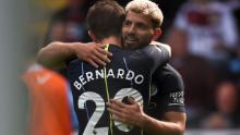 Manchester City&#39;s Argentinian striker Sergio Aguero (R) celebrates scoring the opening goal with Manchester City&#39;s Portuguese midfielder Bernardo Silva (L) during the English Premier League football match between Burnley and Manchester City at Turf Moor in Burnley, north west England on April 28, 2019. (Photo by Oli SCARFF / AFP) / RESTRICTED TO EDITORIAL USE. No use with unauthorized audio, video, data, fixture lists, club/league logos or &#39;live&#39; services. Online in-match use limited to 120 images. An additional 40 images may be used in extra time. No video emulation. Social media in-match use limited to 120 images. An additional 40 images may be used in extra time. No use in betting publications, games or single club/league/player publications. /         (Photo credit should read OLI SCARFF/AFP/Getty Images)