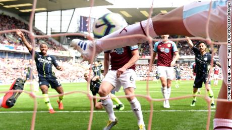 BURNLEY, ENGLAND - APRIL 28:  Matthew Lowton of Burnley fails to Sergio Aguero of Manchester City from scoring his team&#39;s first goal during the Premier League match between Burnley FC and Manchester City at Turf Moor on April 28, 2019 in Burnley, United Kingdom. (Photo by Michael Regan/Getty Images)