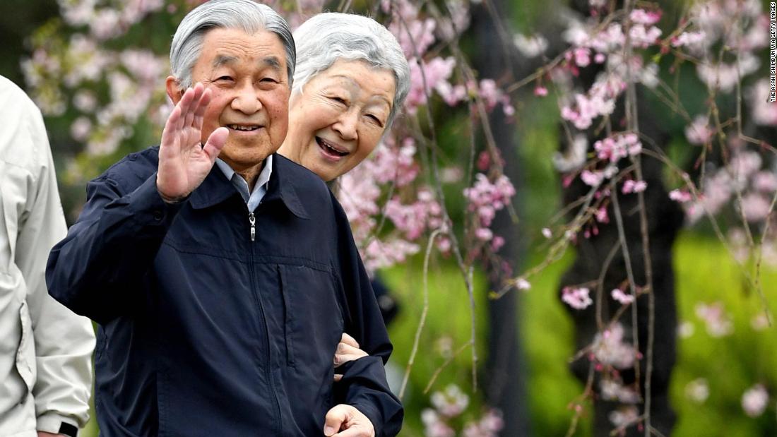 Akihito and Michiko take a brief stroll outside the Imperial Palace in Tokyo in April 2019.