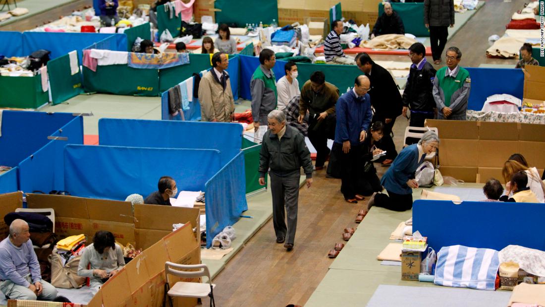 Akihito and Michiko visit an evacuation shelter after the earthquake and tsunami in 2011.