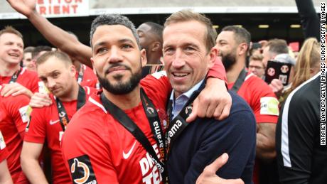 Jobi McAnuff celebrates with manager Justin Edinburgh.