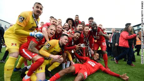 Leyton Orient players celebrate securing promotion to League Two.