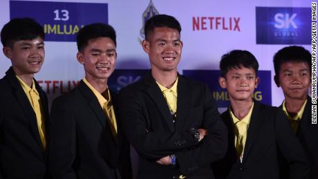 Members of the &#39;Wild Boars&#39; team pose to promote a Netflix series about the rescue of the team.