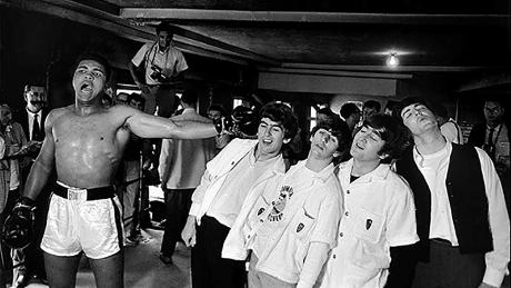 Ali poses with the Beatles in 1964.