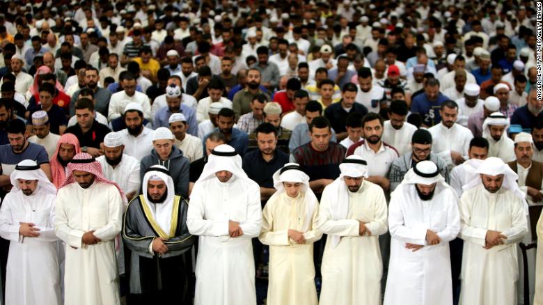 Muslim men pray in Kuwait City's Grand Mosque just before daybreak, during the holy month of Ramadan