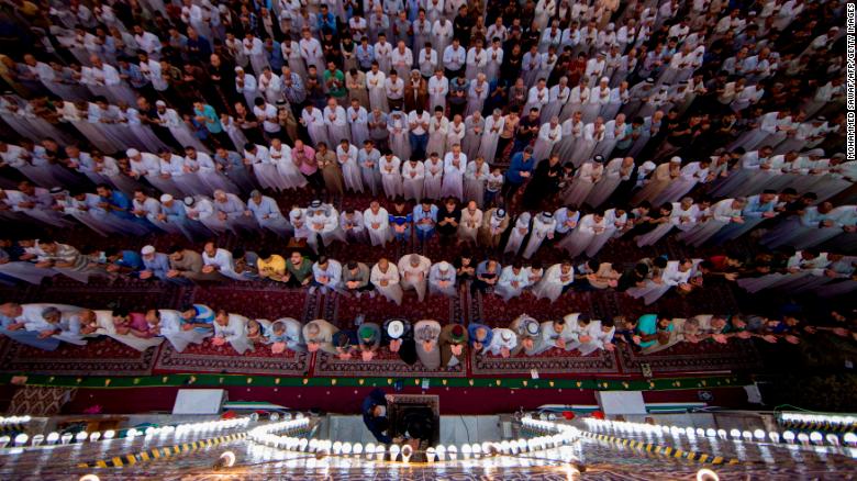 Shiite Muslim worshippers take part in the early morning prayers for Eid al-Fitr after the conclusion of the holy fasting month of Ramadan.