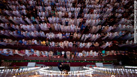 Shiite Muslim worshippers take part in the early morning prayers for Eid al-Fitr after the conclusion of the holy fasting month of Ramadan.